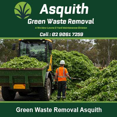 Worker next to truck loaded with green waste Asquith